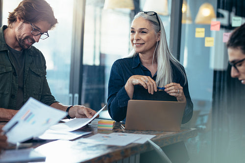 Business team analyzing financials documents in a meeting