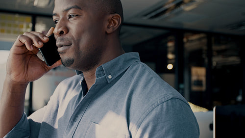 African businessman making a phone call