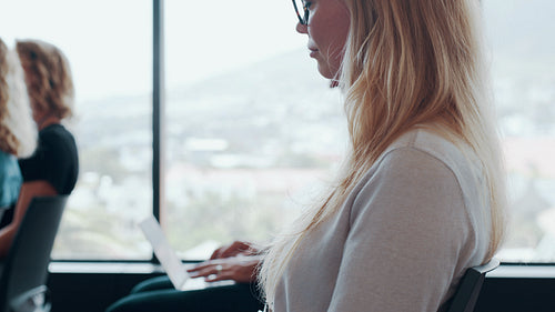 Business associates discussing during corporate seminar