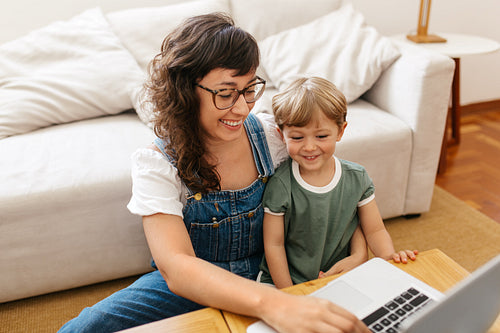 Woman with son working from home