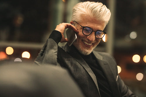 Mature business executive making a phone call