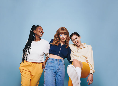 Happy female friends having fun together in a studio