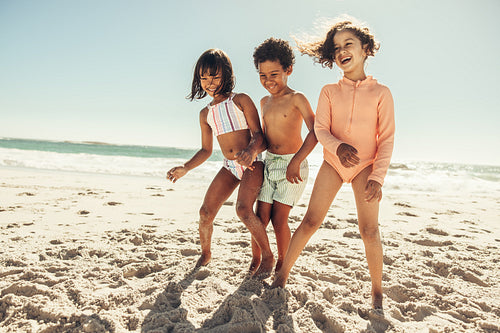 Cheerful children having fun at the beach