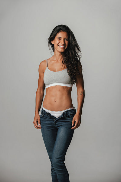 Smiling sexy young woman in her underwear