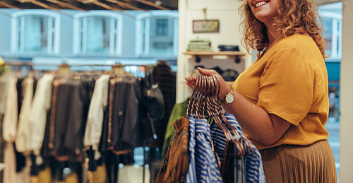 Woman working in clothing store