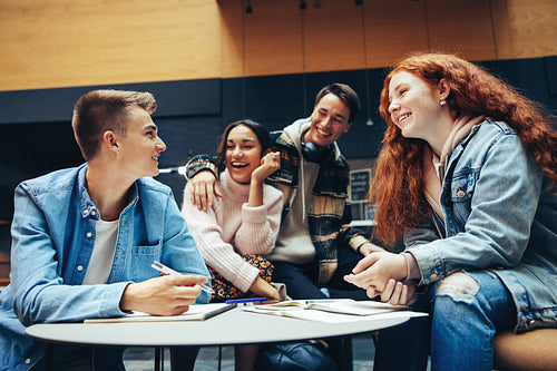 Teenagers in college campus doing project