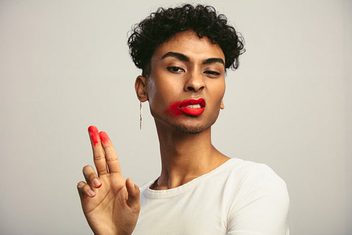 Gay man with smeared lipstick