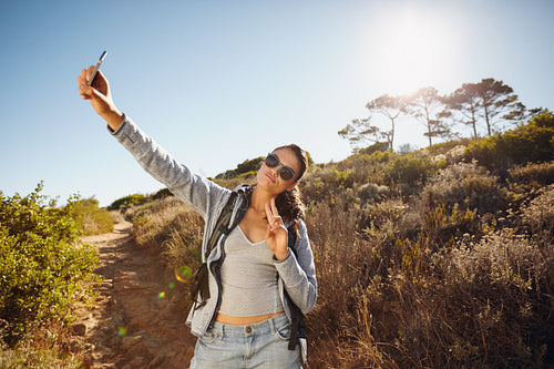 Young woman hiker a selfie in nature