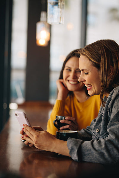 Friends spending their free time at cafe
