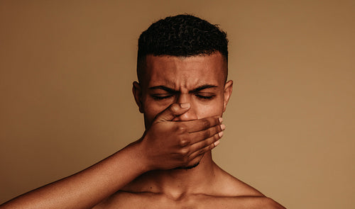 Close up of african american man struggling to breathe