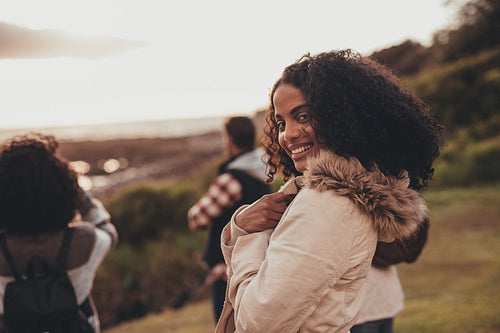 Smiling woman on holiday with friends