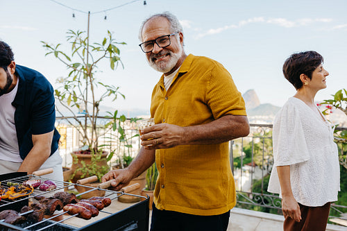Outdoor Brazilian barbecue with friends and family enjoying churrasco together