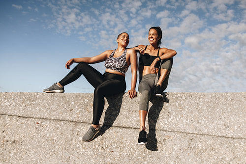 Fitness women relaxing after training session
