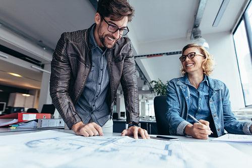 Two architects working on construction plan