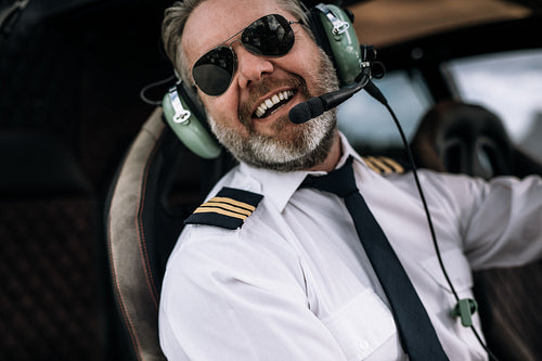 Smiling helicopter pilot with headset