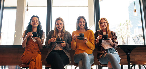 Ladies group enjoying coffee in cafe