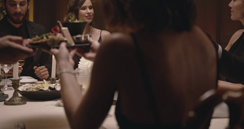 Group of friends having dinner at home