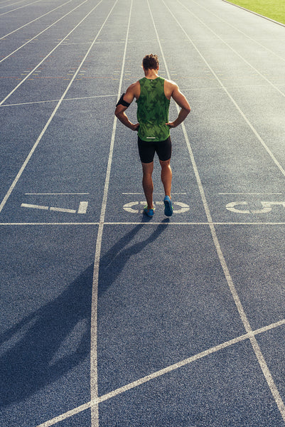 Sprinter standing on running track