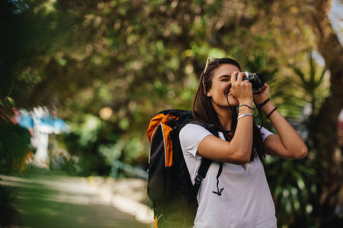Woman on vacation taking photographs