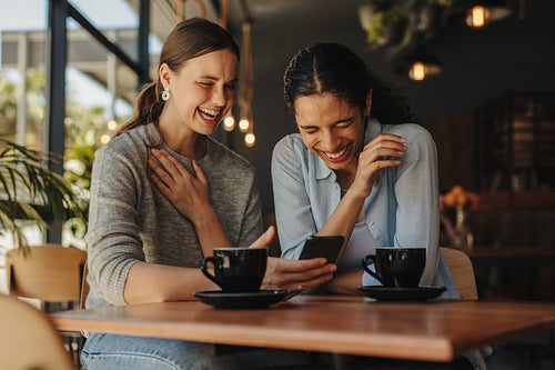 Friends having a great time on a cafe