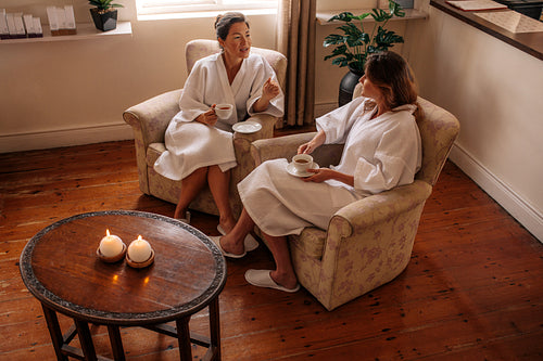 Two women talking while waiting for spa