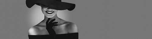 Monochrome portrait of elegant woman in back dress