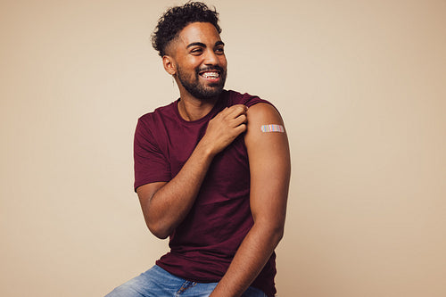 Man smiling after receiving vaccination
