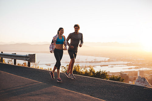 Young couple jogging early in morning