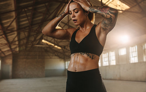 Woman feeling exhausted after intense workout