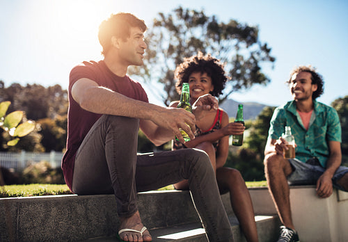 Friends having fun and drinking beers outdoor