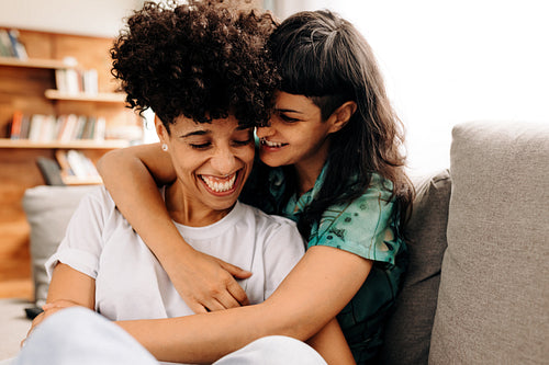 Female lovers smiling and embracing each other