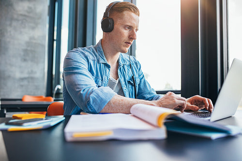 University student studying in library