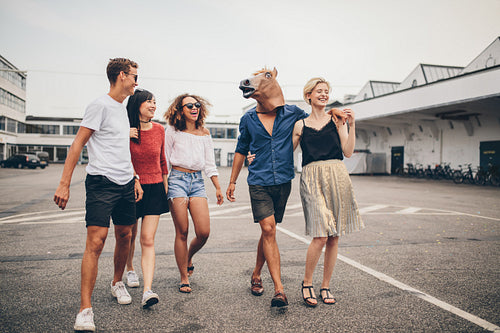 Young friends enjoying together on the street