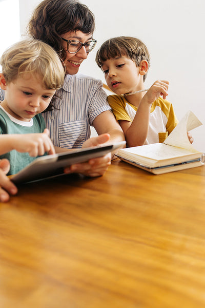 Young family together with a digital tablet
