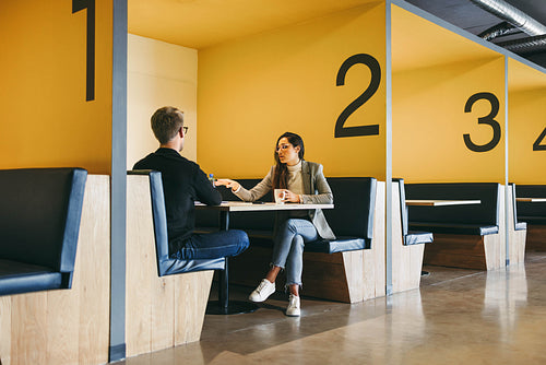 Collaborative workspace: Professionals engaged in productive discussion and remote work