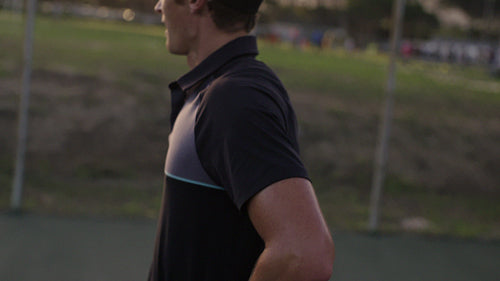 Tennis player feeling exhausted during a match