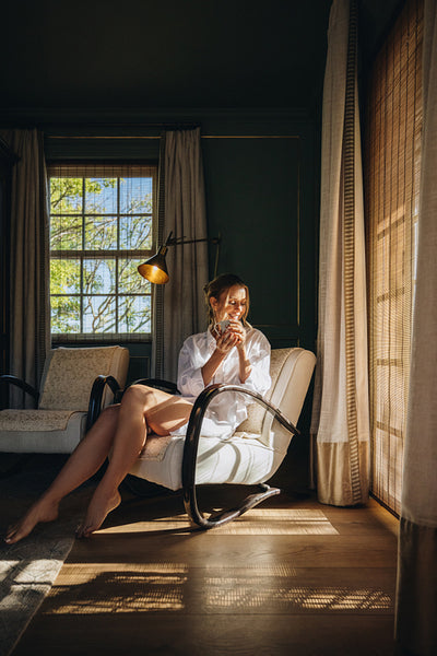 Serene woman relaxing in her hotel room