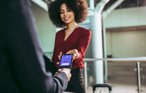 Passenger using electronic boarding pass to check in