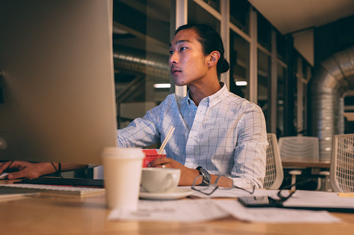 Businessman working late night in office
