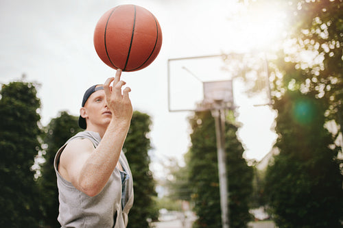 Streetball player spinning the ball
