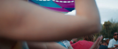 Energetic young people dancing at a music festival