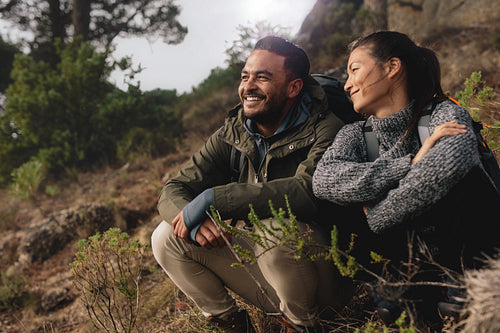Young couple out on hike in mountains