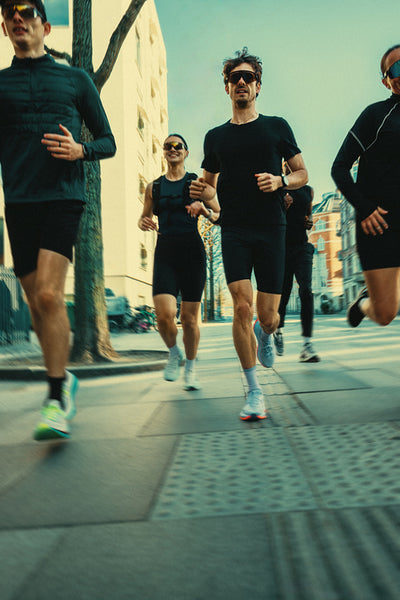 Group running brings people together on a city street for urban training