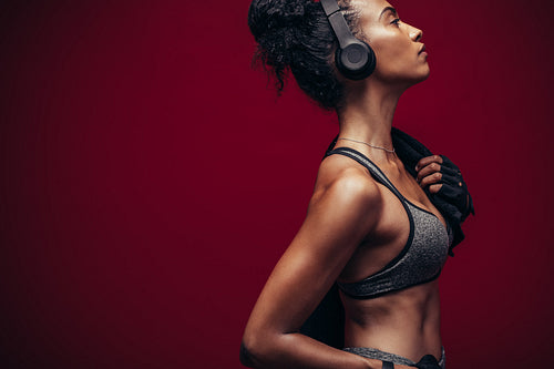 Fitness woman in sportswear and headphones