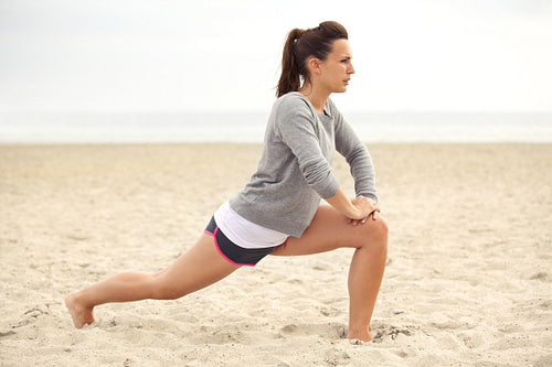 Fitness Woman on the Beach Training