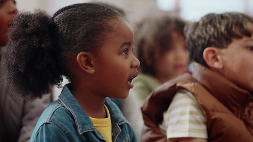 Sing and learn the alphabet: Diverse primary school kids singing the alphabet song in a co-ed classroom