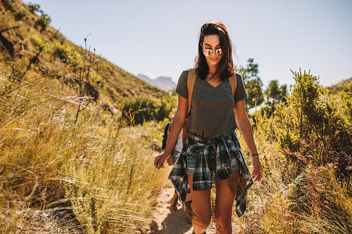 Woman with friends hiking in country side