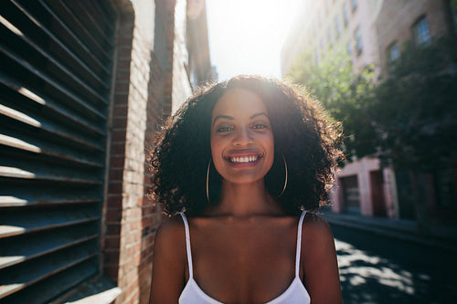 Smiling african woman on road