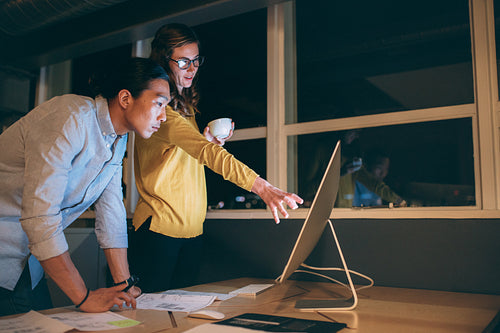 Business colleagues working late in the night at office