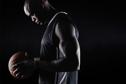 African american basketball player with ball